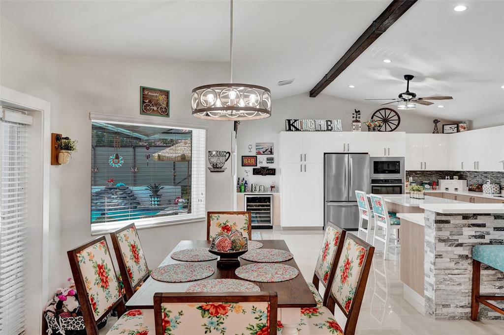 5076 Northwest 84th Road Coral Springs, FL 33067 - Photo 19 of 74 a living room with lots of furniture and kitchen view