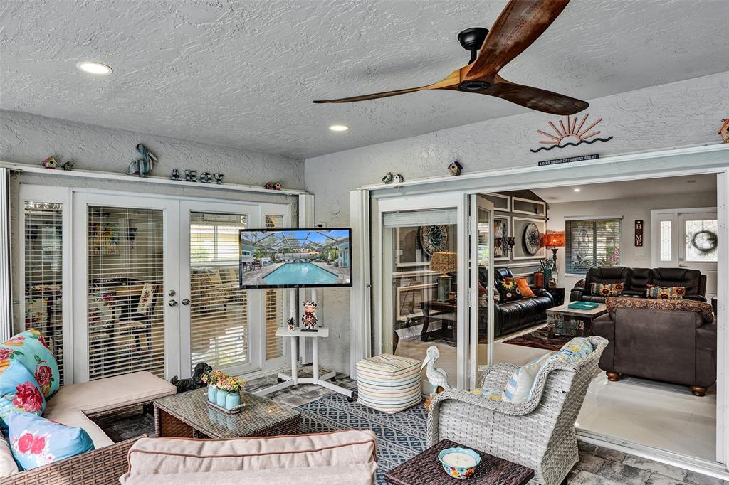 5076 Northwest 84th Road Coral Springs, FL 33067 - Photo 21 of 74 a living room with furniture and a ceiling fan