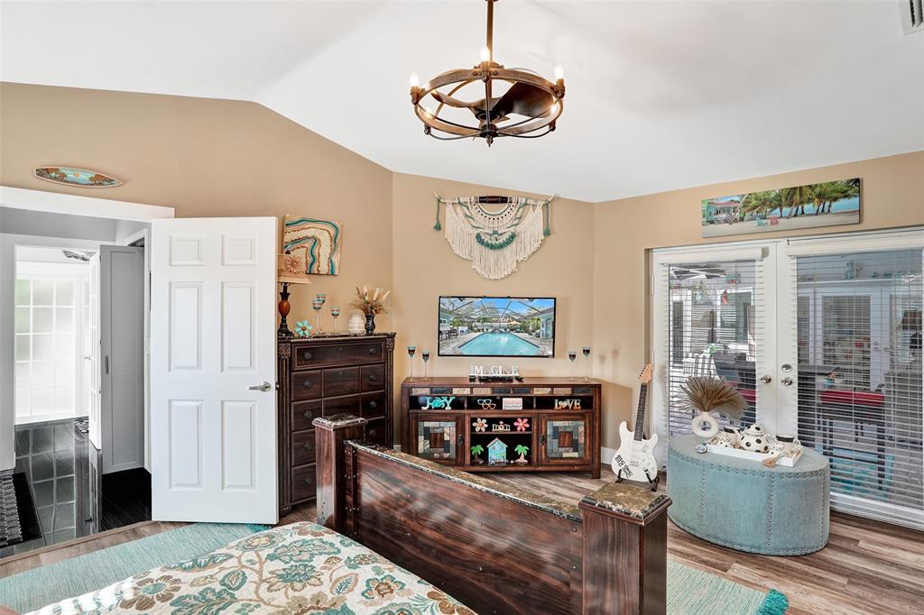 5076 Northwest 84th Road Coral Springs, FL 33067 - Photo 25 of 74 a living room with furniture and a flat screen tv