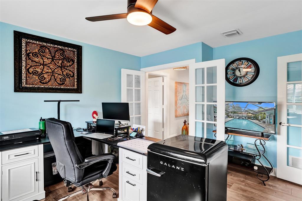 5076 Northwest 84th Road Coral Springs, FL 33067 - Photo 40 of 74 a view of a workspace with furniture and a window