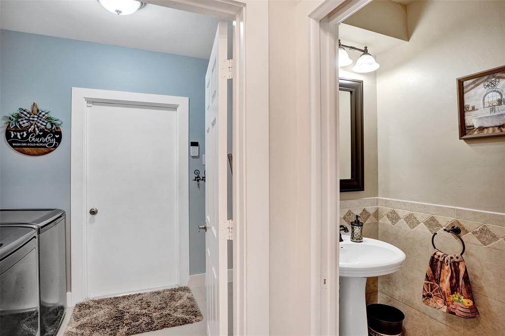 5076 Northwest 84th Road Coral Springs, FL 33067 - Photo 49 of 74 a bathroom with a sink and a mirror