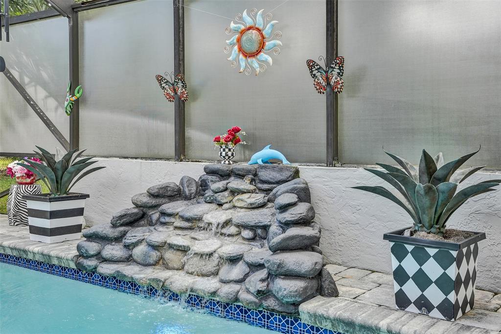 5076 Northwest 84th Road Coral Springs, FL 33067 - Photo 55 of 74 a vase of flowers sitting on a table