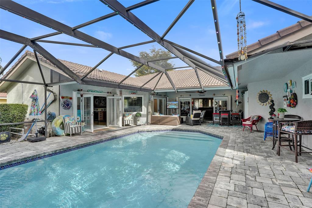5076 Northwest 84th Road Coral Springs, FL 33067 - Photo 57 of 74 a view of a house with sitting area