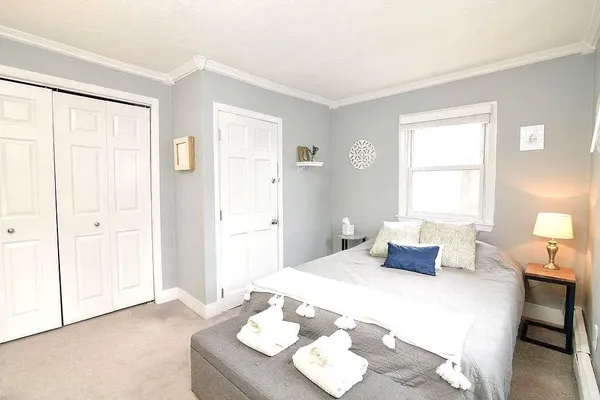 a bedroom with a bed and a table in it