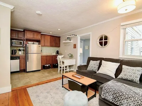a living room with furniture and a rug