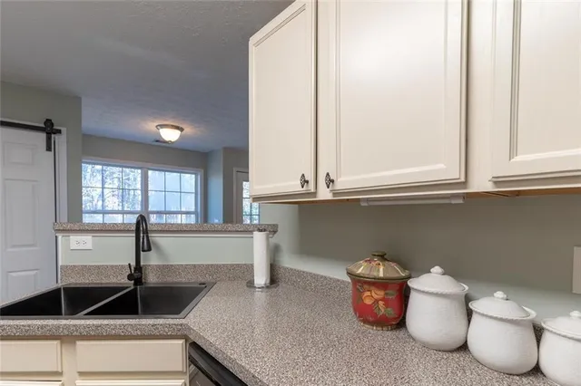 a kitchen with a sink and a window