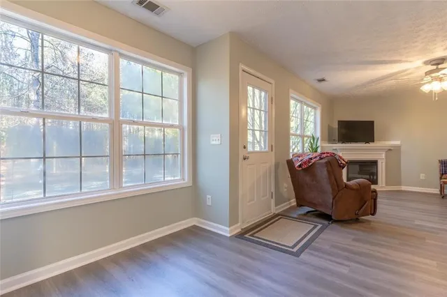 a view of livingroom with furniture wooden floor and window