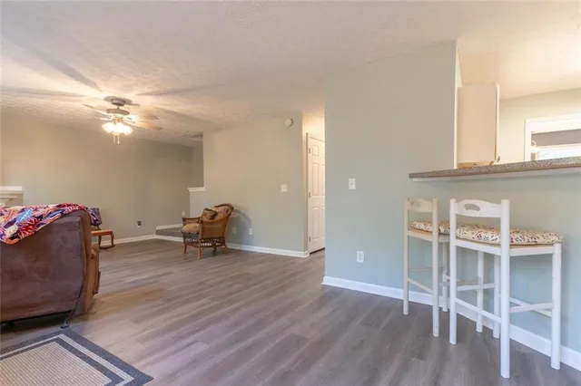 a view of a livingroom with furniture and wooden floor