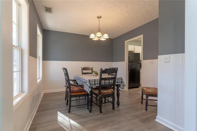 a view of a dining room with furniture and window