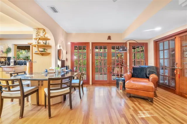 a view of a dining room with furniture window and wooden floor