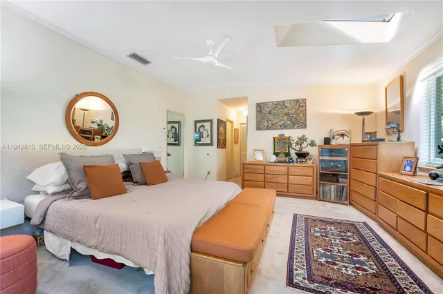 a bedroom with furniture and a window