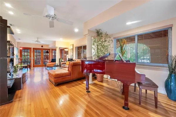a living room with furniture and a large window