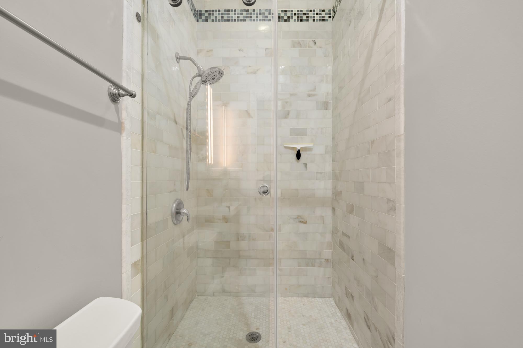 3529 14th Street Northwest, Unit 1 Washington, DC 20010 - Photo 10 of 14 a bathroom with a shower curtain