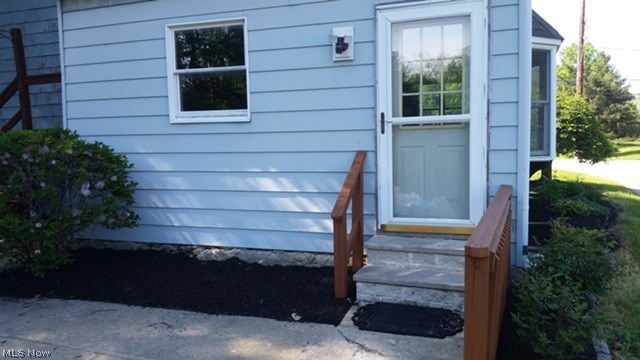 4196 South Ridge Road East Geneva, OH 44041 - Photo 8 of 26 Rear entrance of house to the kitchen from parking area.