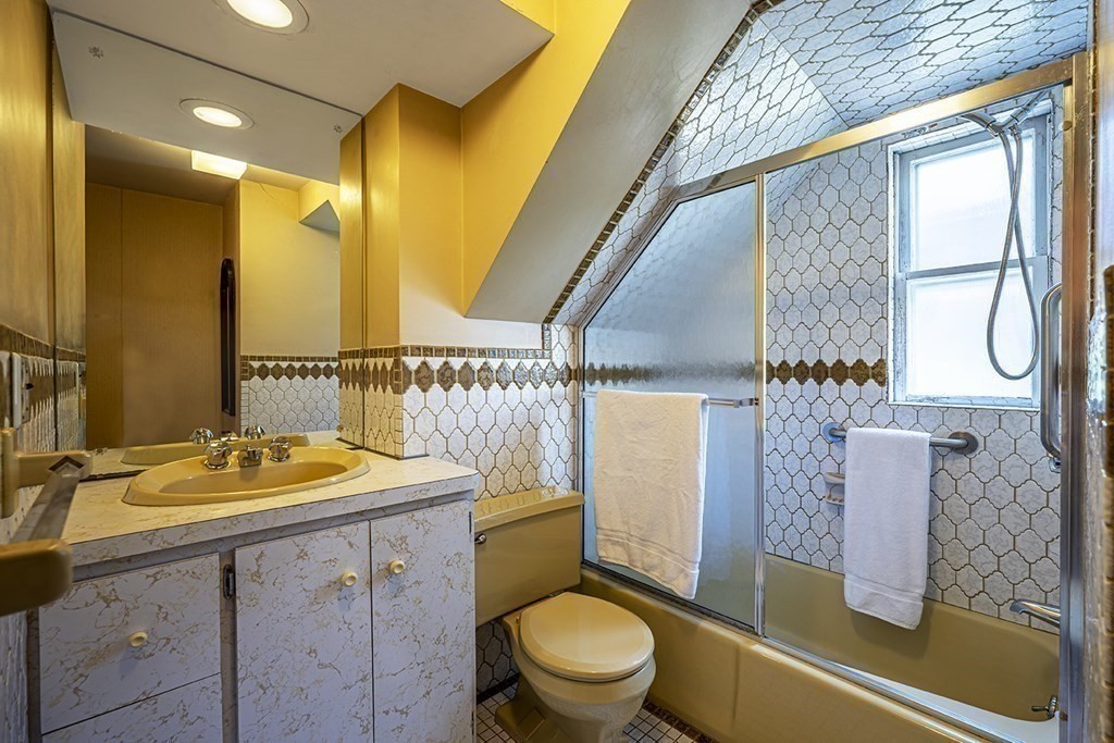 72 Rice Street, Unit 72 Cambridge, MA 02140 - Photo 12 of 20 a bathroom with a sink a toilet and shower
