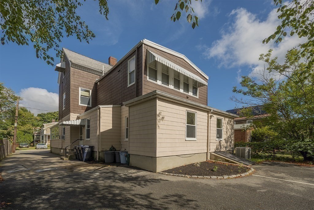 72 Rice Street, Unit 72 Cambridge, MA 02140 - Photo 15 of 20 a front view of a house with a yard