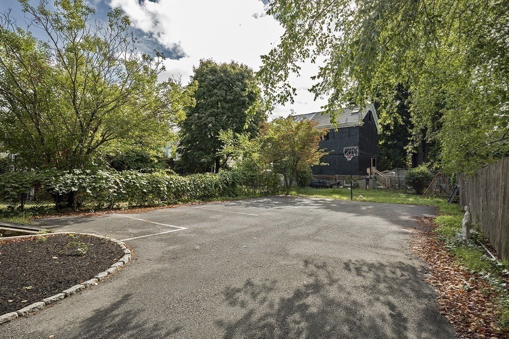72 Rice Street, Unit 72 Cambridge, MA 02140 - Photo 18 of 20 a view of a yard with a tree