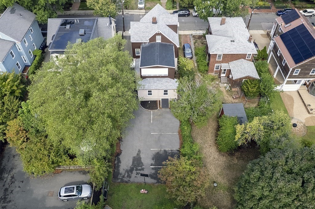 72 Rice Street, Unit 72 Cambridge, MA 02140 - Photo 19 of 20 an aerial view of a house with a yard and a lot of flower plants