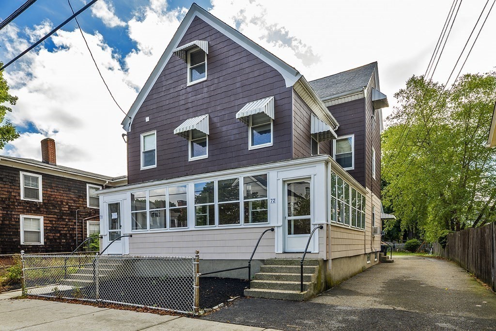 72 Rice Street, Unit 72 Cambridge, MA 02140 - Photo 20 of 20 a front view of a house with a yard