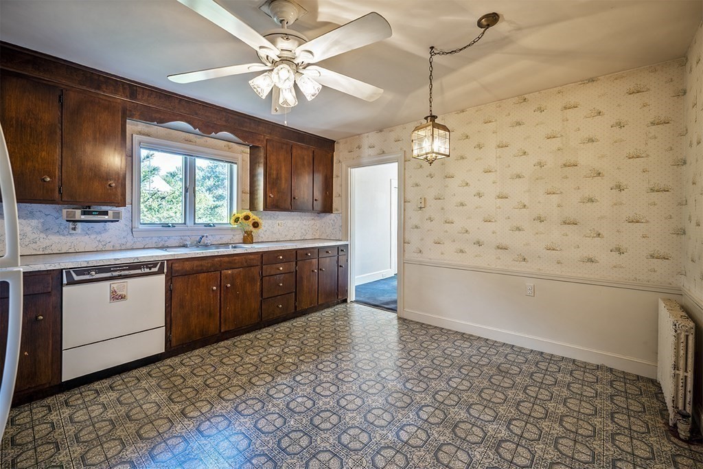 72 Rice Street, Unit 72 Cambridge, MA 02140 - Photo 5 of 20 a kitchen with a sink a stove cabinets and counter space