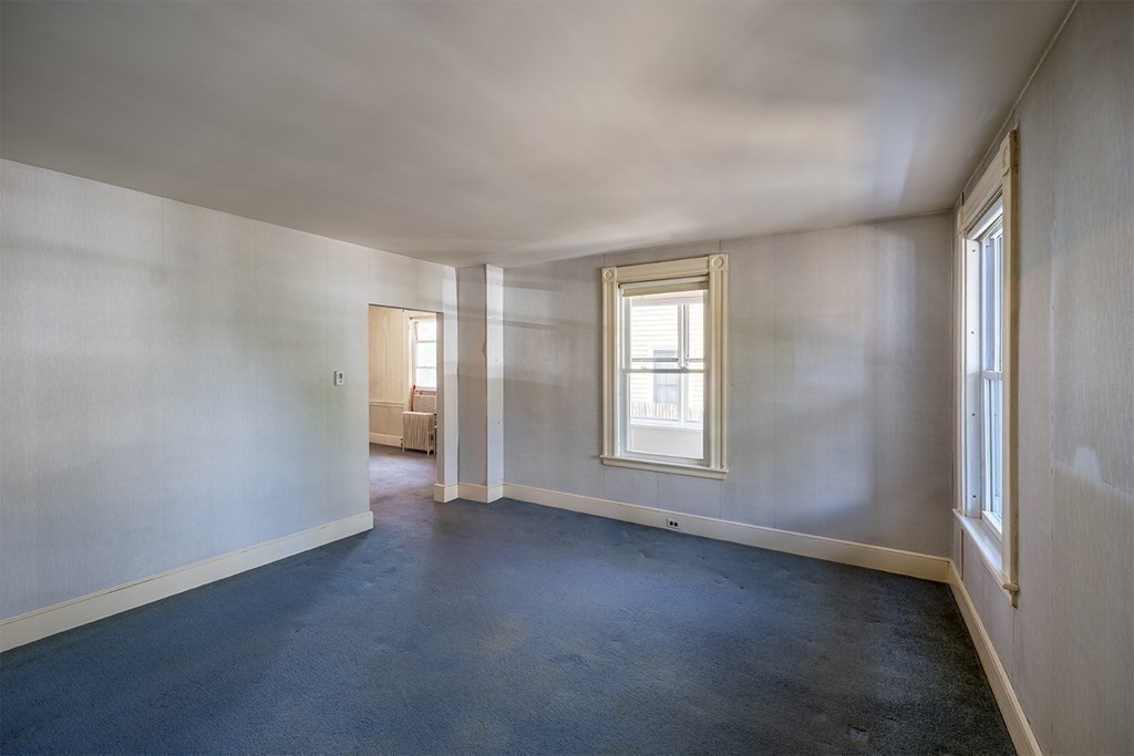 72 Rice Street, Unit 72 Cambridge, MA 02140 - Photo 7 of 20 an empty room with windows