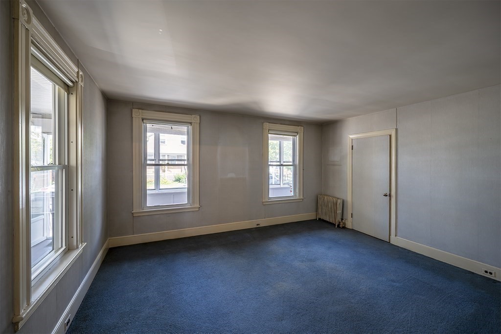 72 Rice Street, Unit 72 Cambridge, MA 02140 - Photo 8 of 20 an empty room with windows