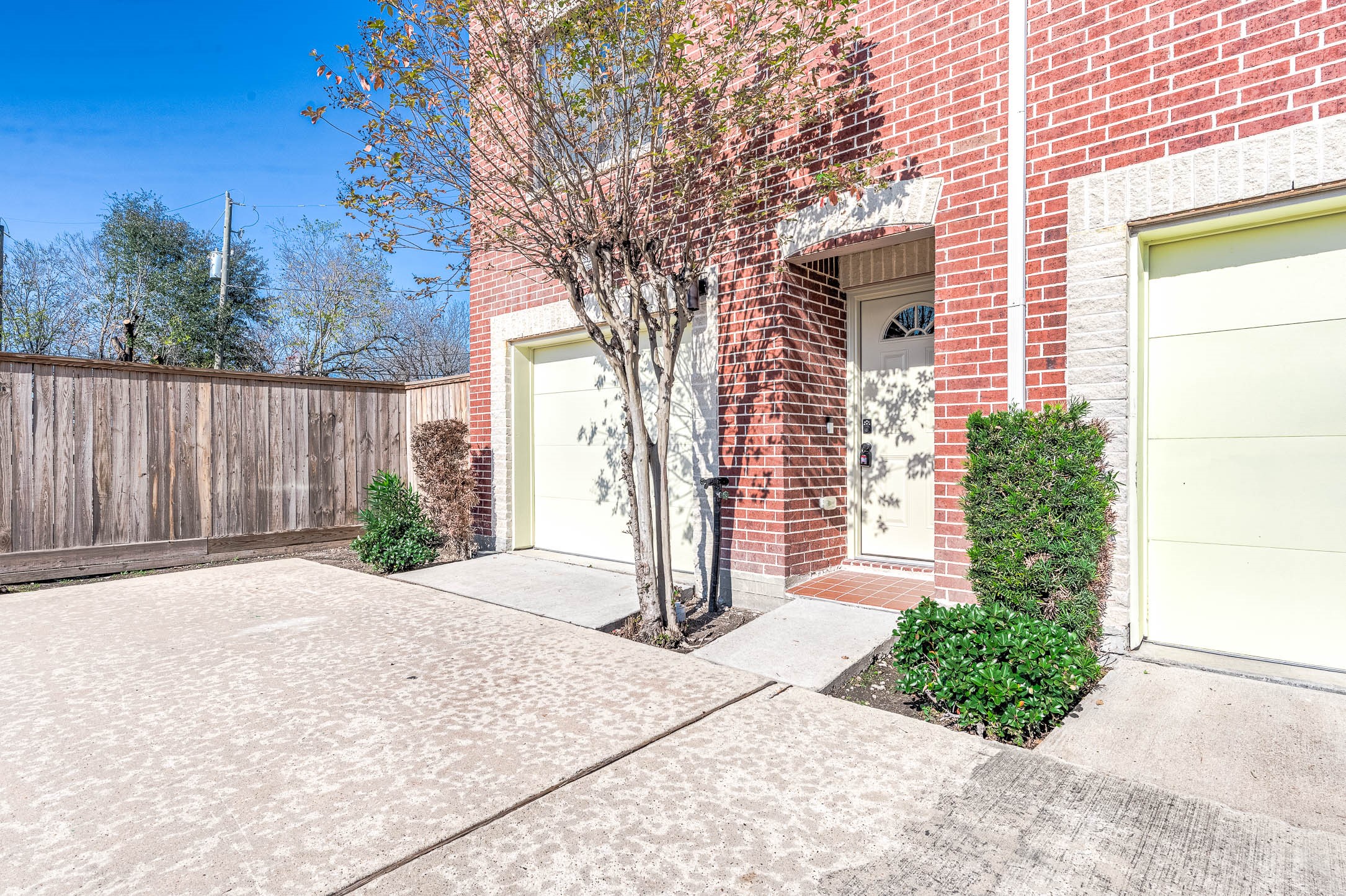 7650 Springhill Street, Unit 704 Houston, TX 77021 - Photo 1 of 23 a front view of a house with a yard and garage