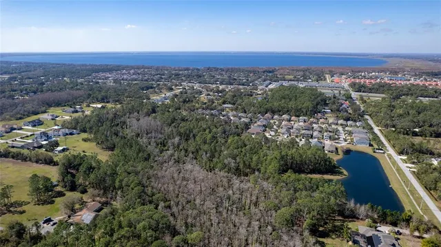 an aerial view of residential house and green space