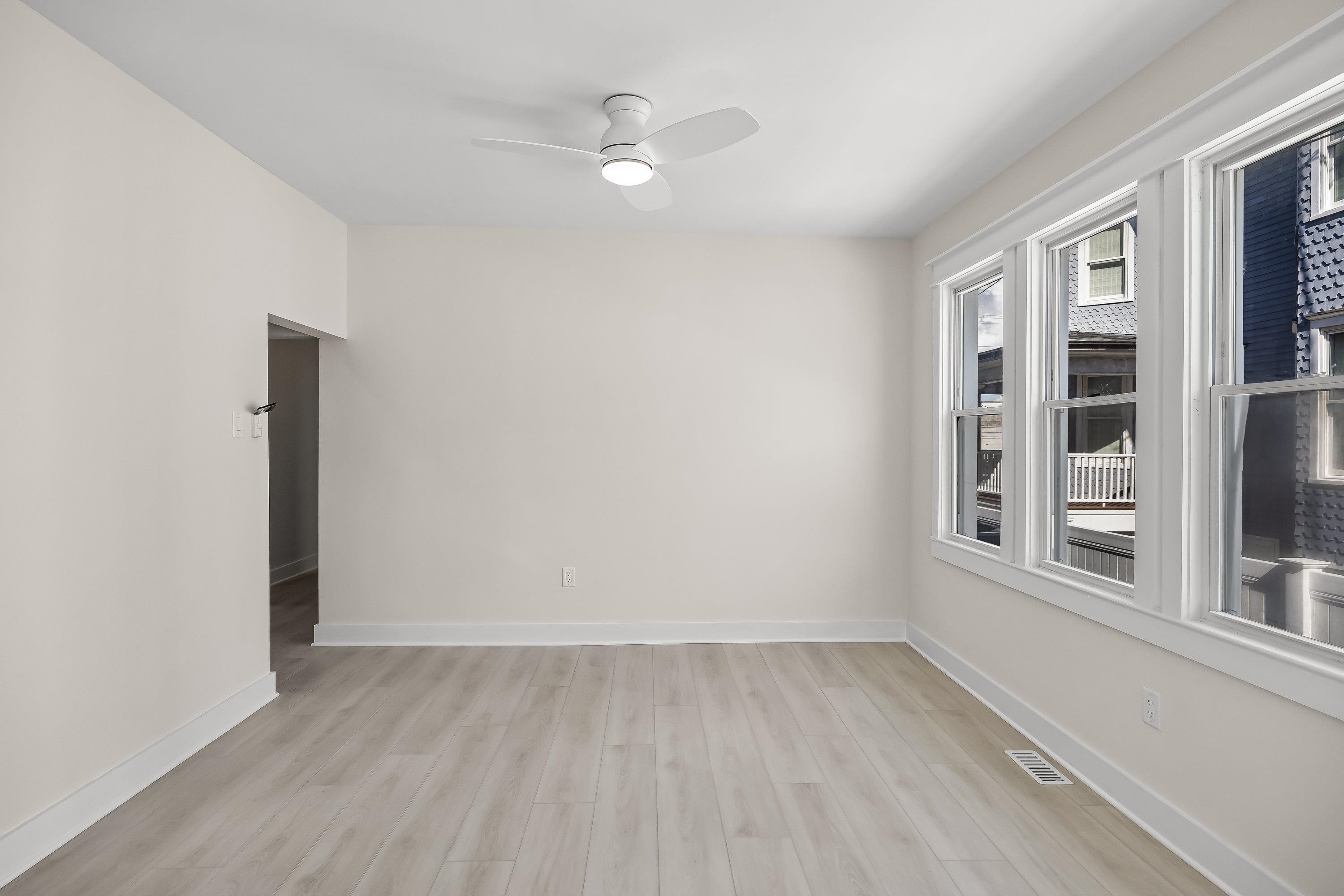 733 Wesley Road, Unit NORTH Ocean City, NJ 08226 - Photo 11 of 47 wooden floor in an empty room with a window