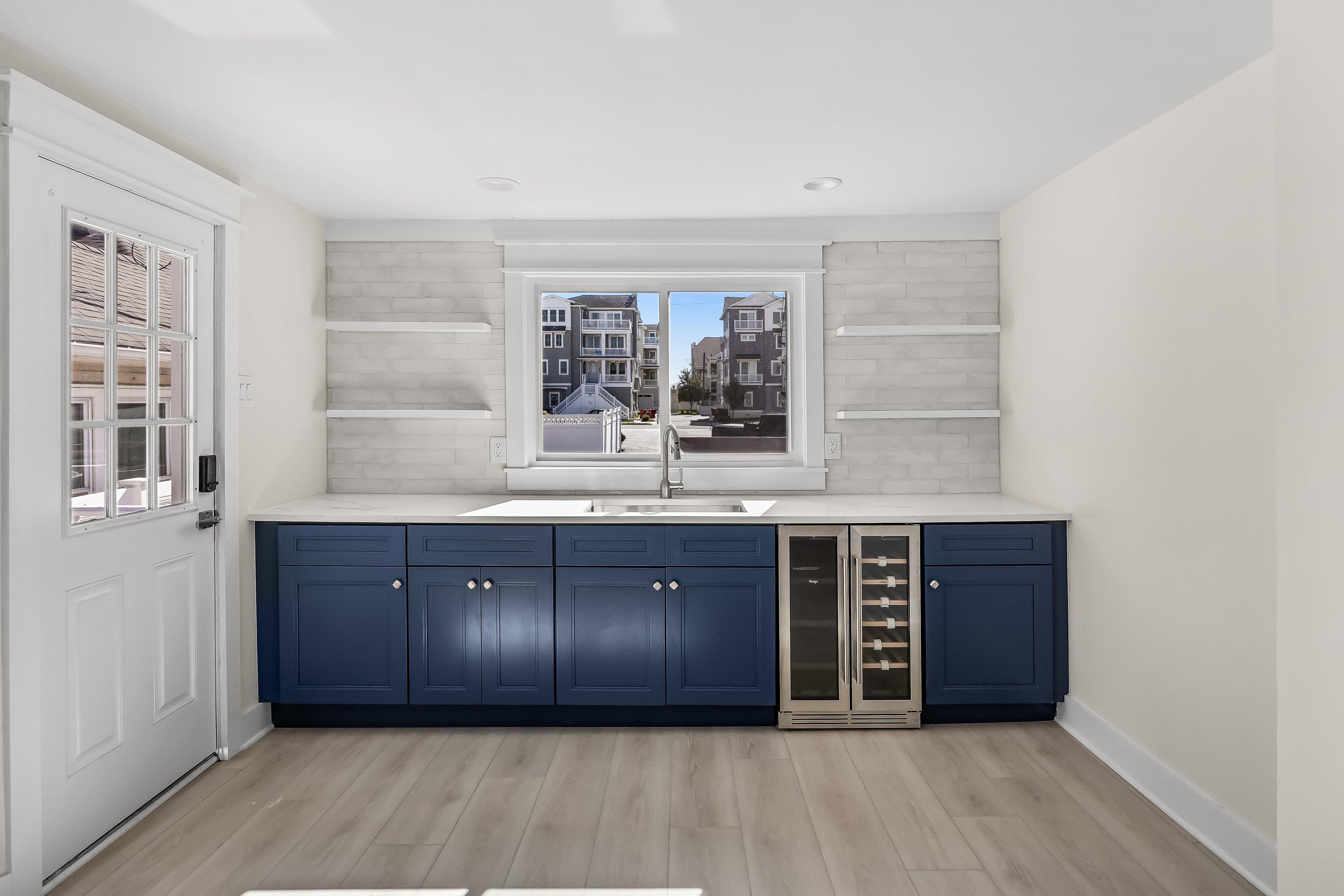 733 Wesley Road, Unit NORTH Ocean City, NJ 08226 - Photo 12 of 47 a large room with a large window and double vanity