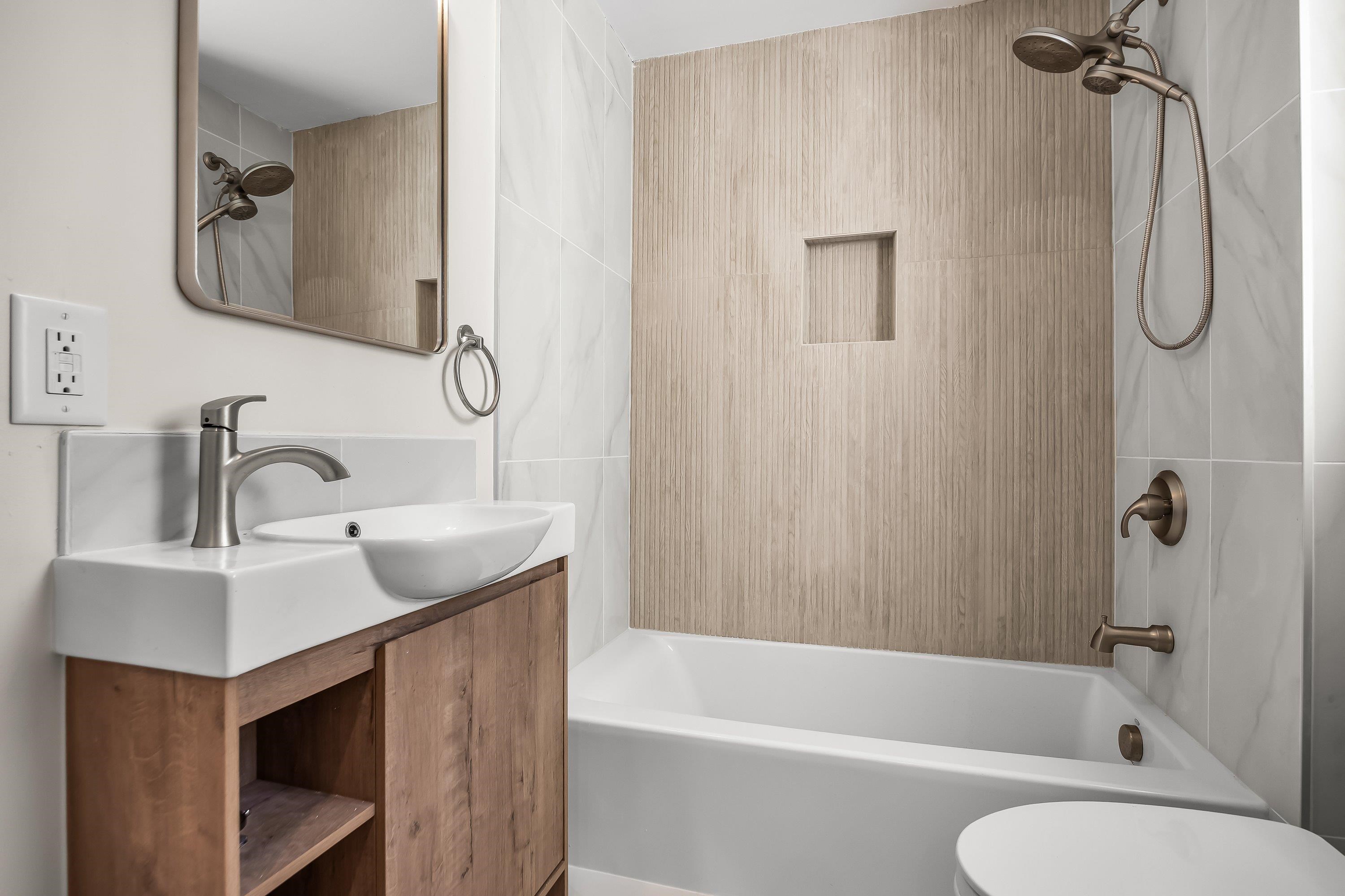 733 Wesley Road, Unit NORTH Ocean City, NJ 08226 - Photo 13 of 47 a bathroom with a sink vanity toilet and shower