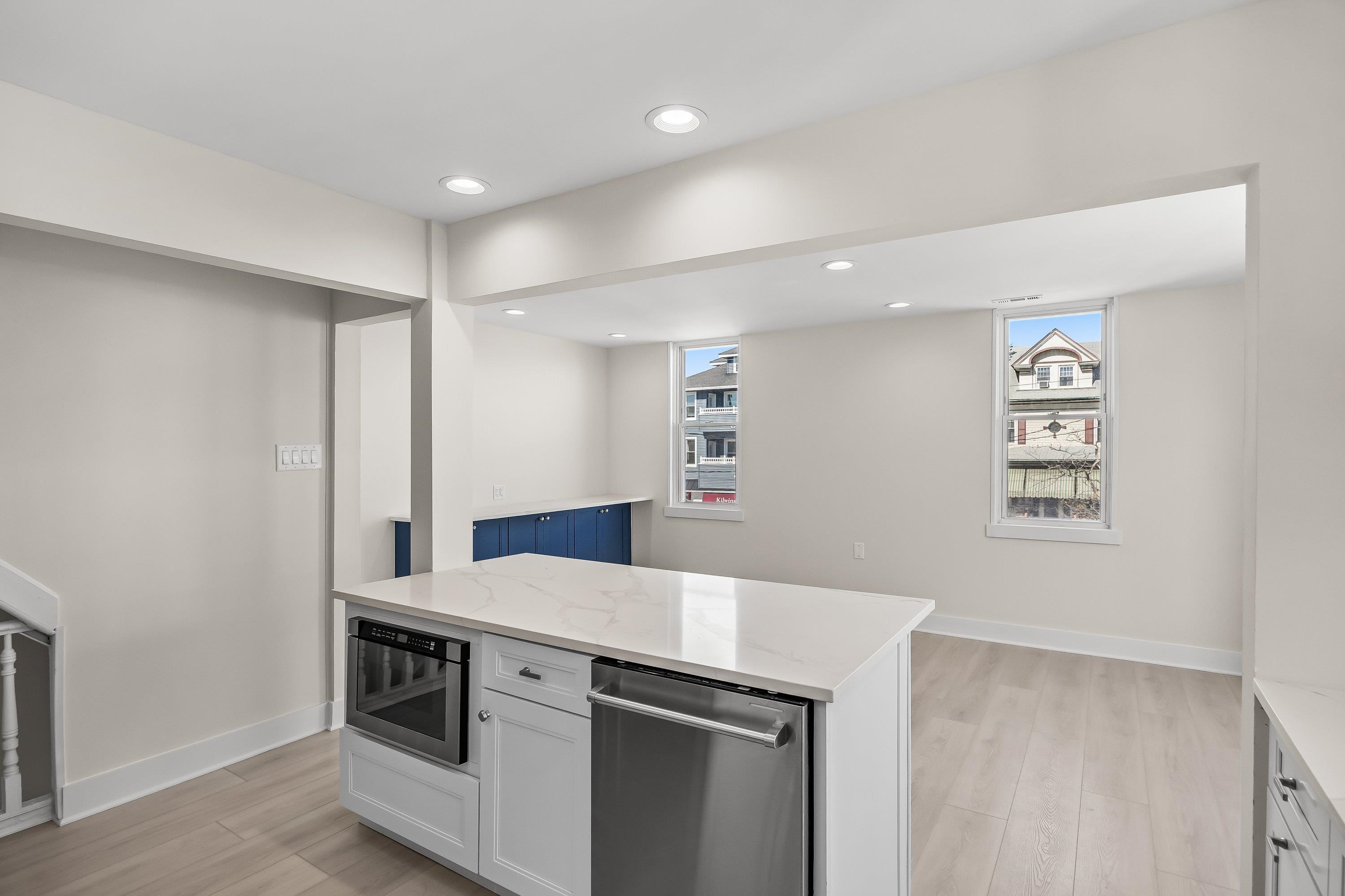 733 Wesley Road, Unit NORTH Ocean City, NJ 08226 - Photo 17 of 47 a kitchen with a stove and a refrigerator