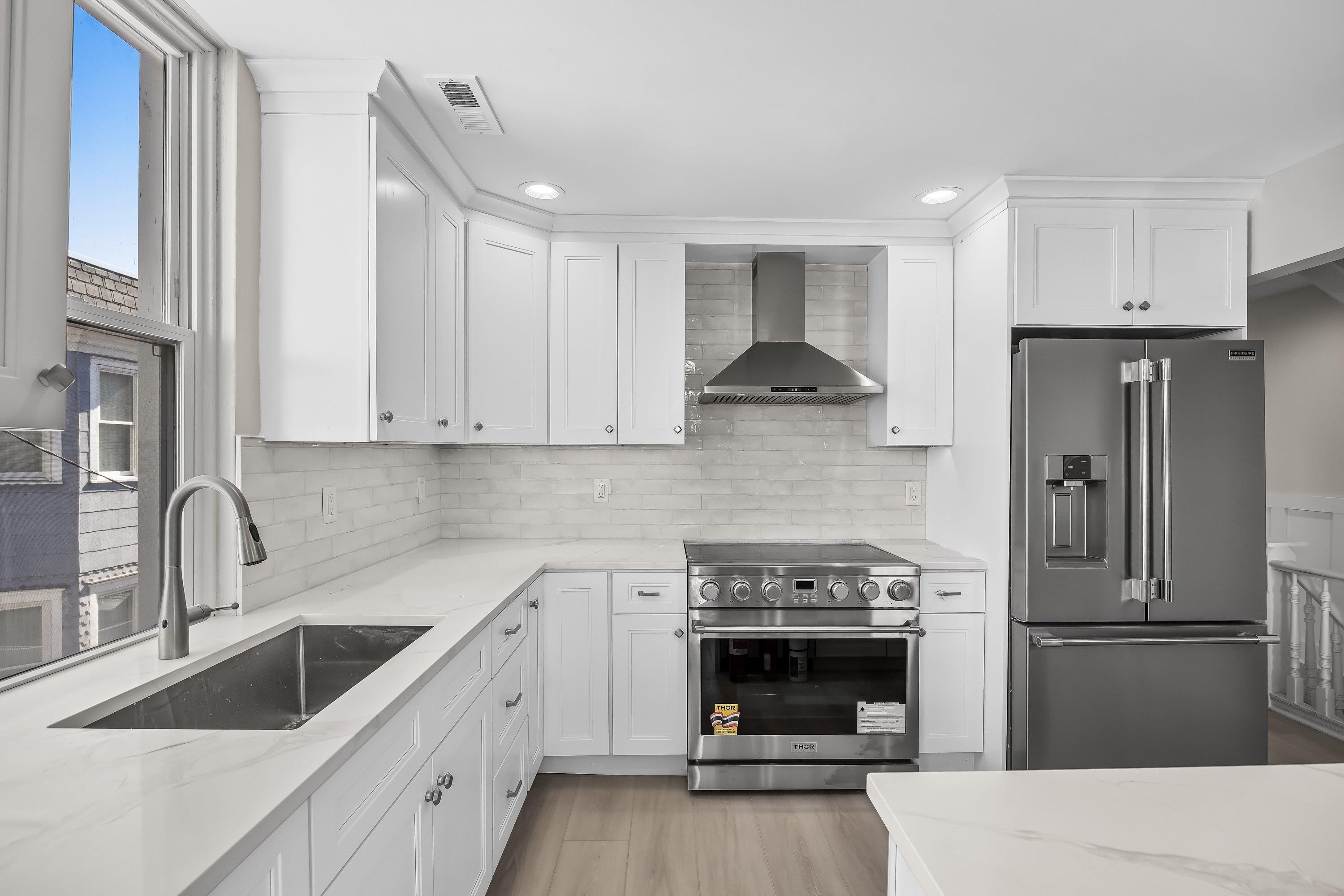 733 Wesley Road, Unit NORTH Ocean City, NJ 08226 - Photo 20 of 47 a kitchen with a sink stove and refrigerator
