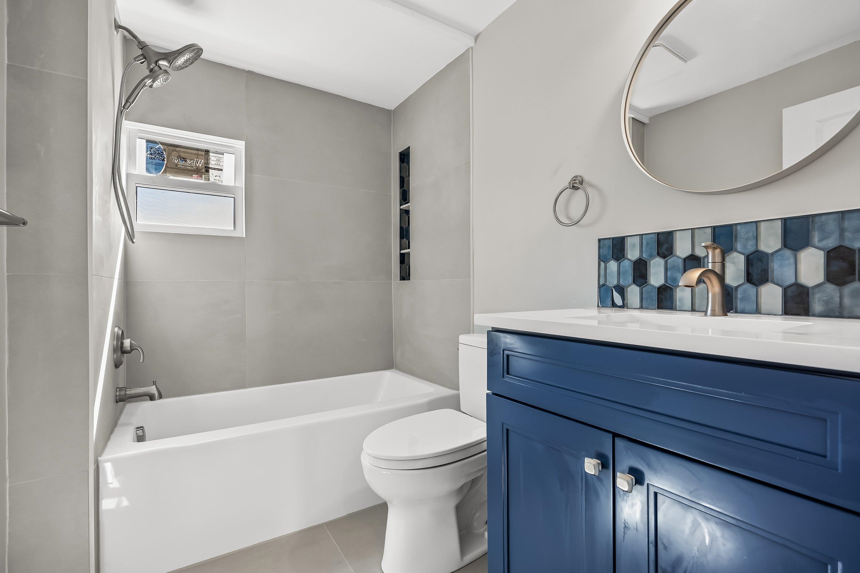 733 Wesley Road, Unit NORTH Ocean City, NJ 08226 - Photo 24 of 47 a bathroom with a toilet a sink and bathtub