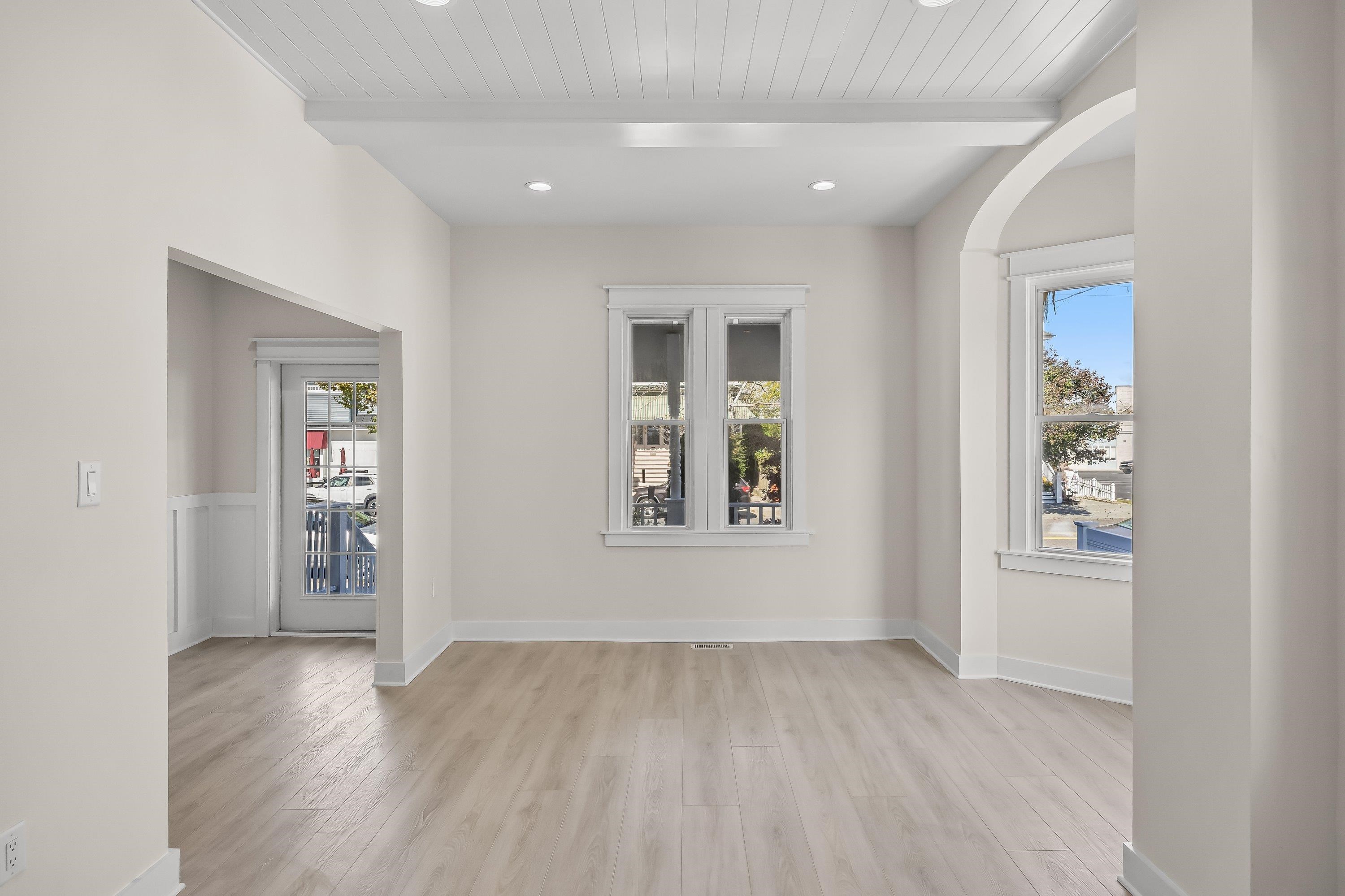 733 Wesley Road, Unit NORTH Ocean City, NJ 08226 - Photo 8 of 47 wooden floor in an empty room with a window