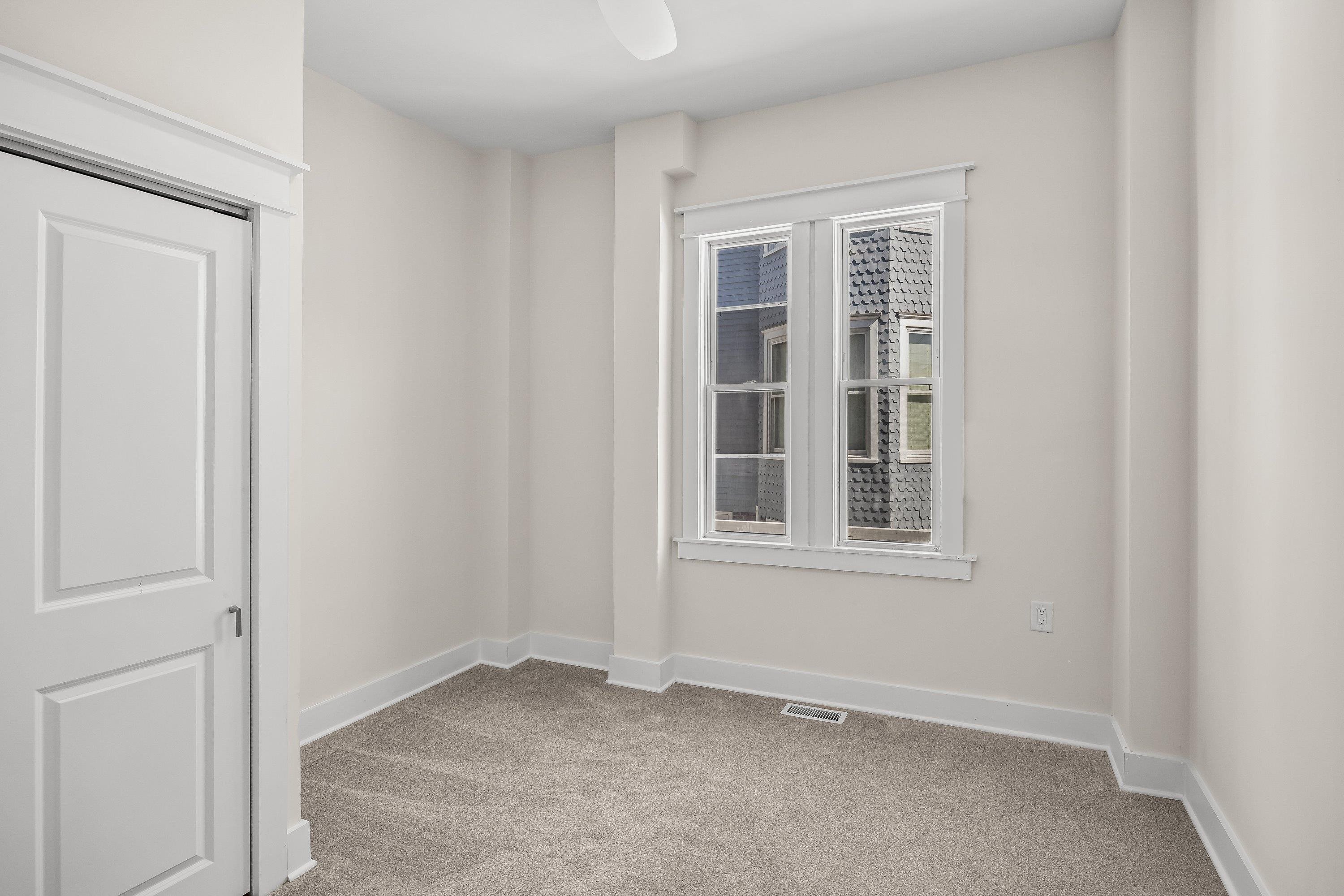 733 Wesley Road, Unit NORTH Ocean City, NJ 08226 - Photo 9 of 47 an empty room with windows