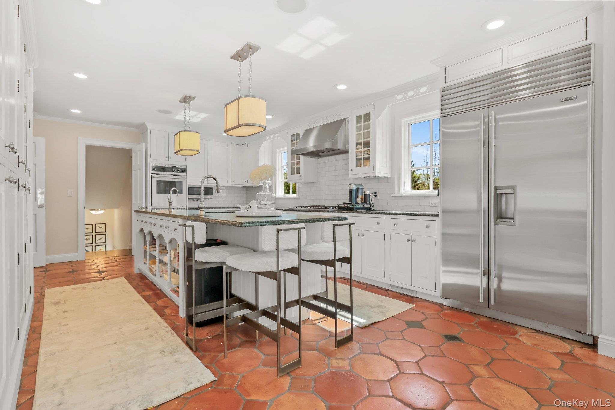 7 Plateau Circle West Bronxville, NY 10708 - Photo 13 of 34 a kitchen with stainless steel appliances kitchen island granite countertop a sink and cabinets
