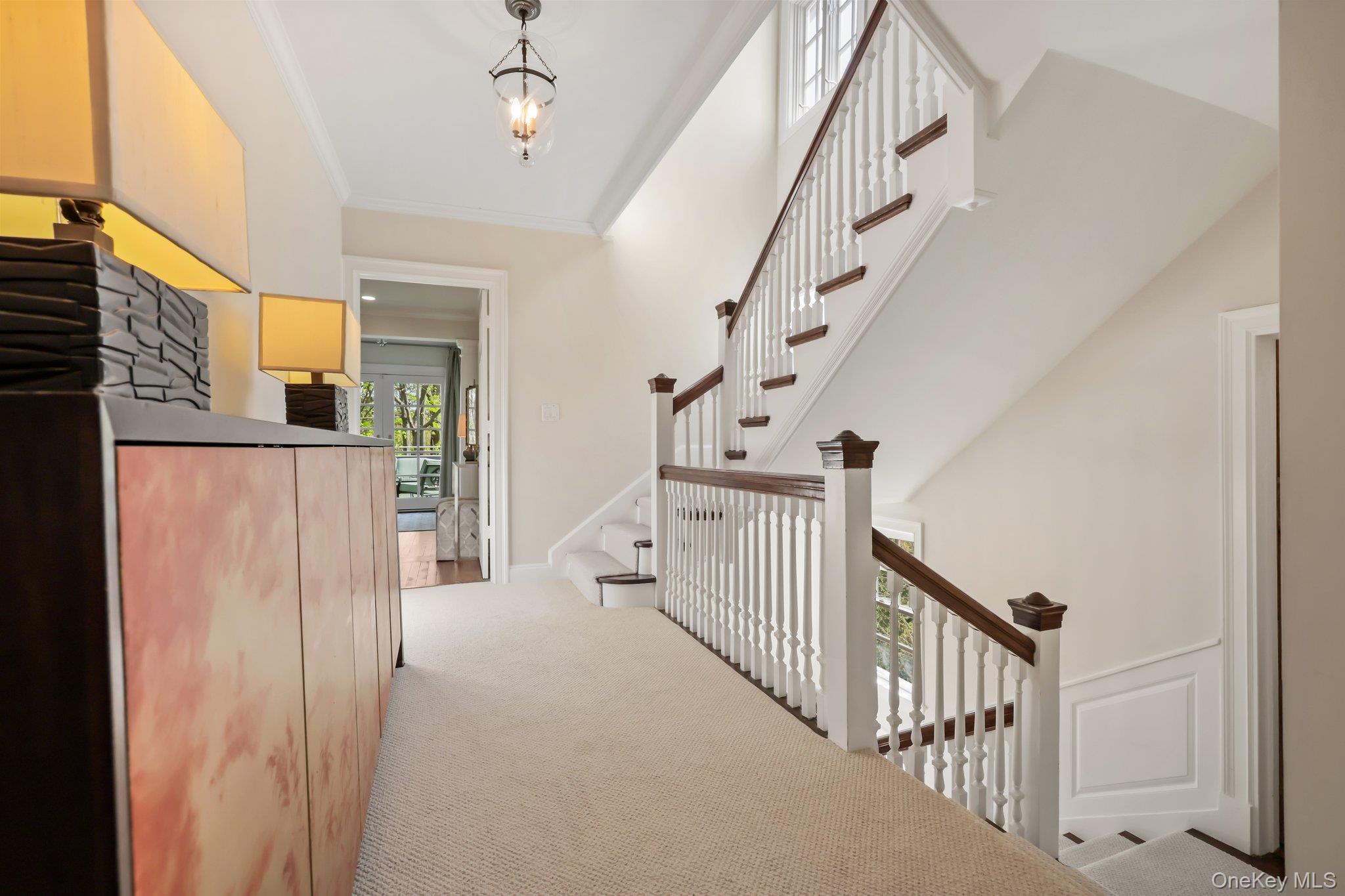 7 Plateau Circle West Bronxville, NY 10708 - Photo 17 of 34 a view of staircase with lots of frames on wall and a window