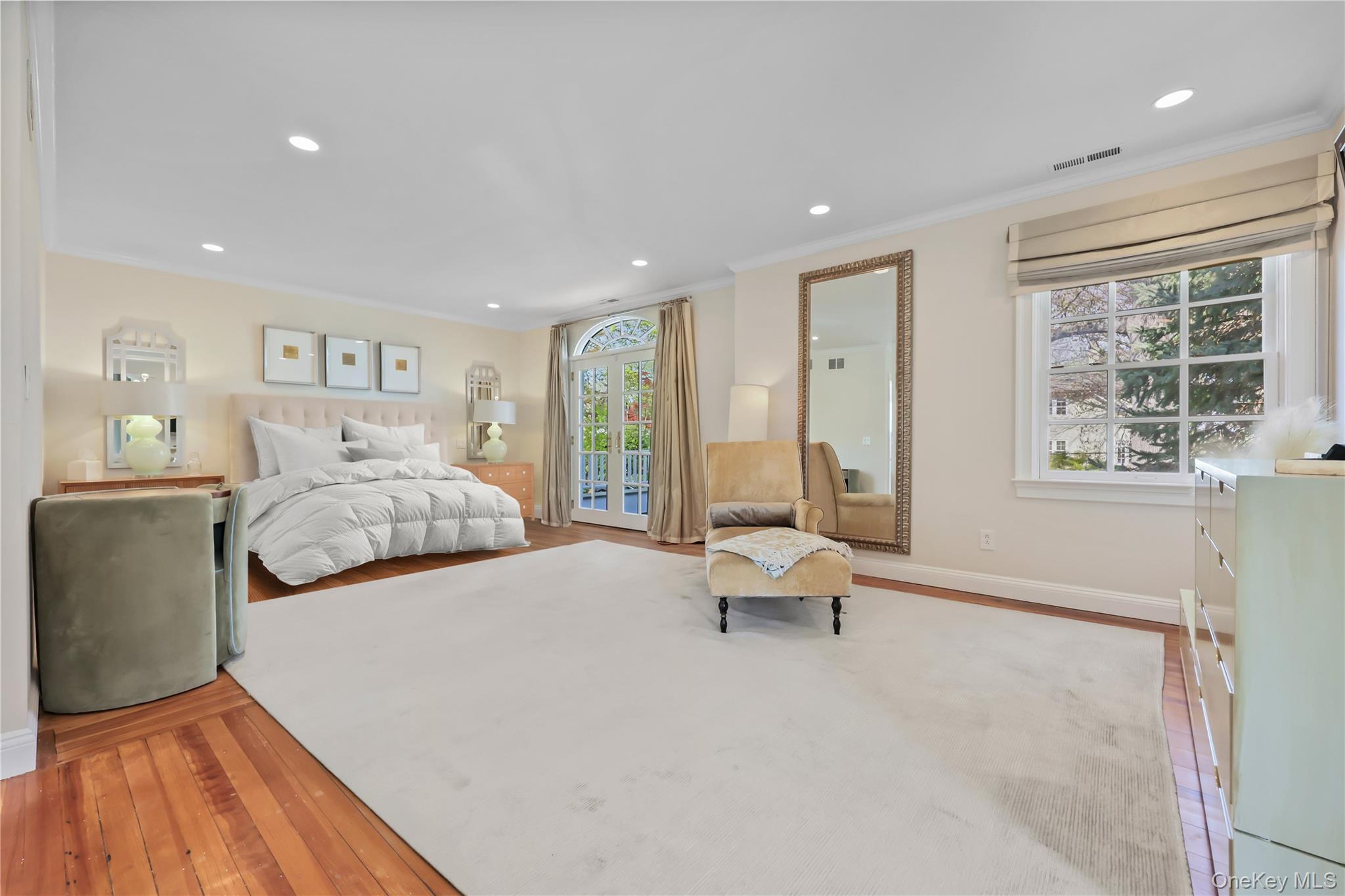 7 Plateau Circle West Bronxville, NY 10708 - Photo 18 of 34 a bedroom with a bed and a large window