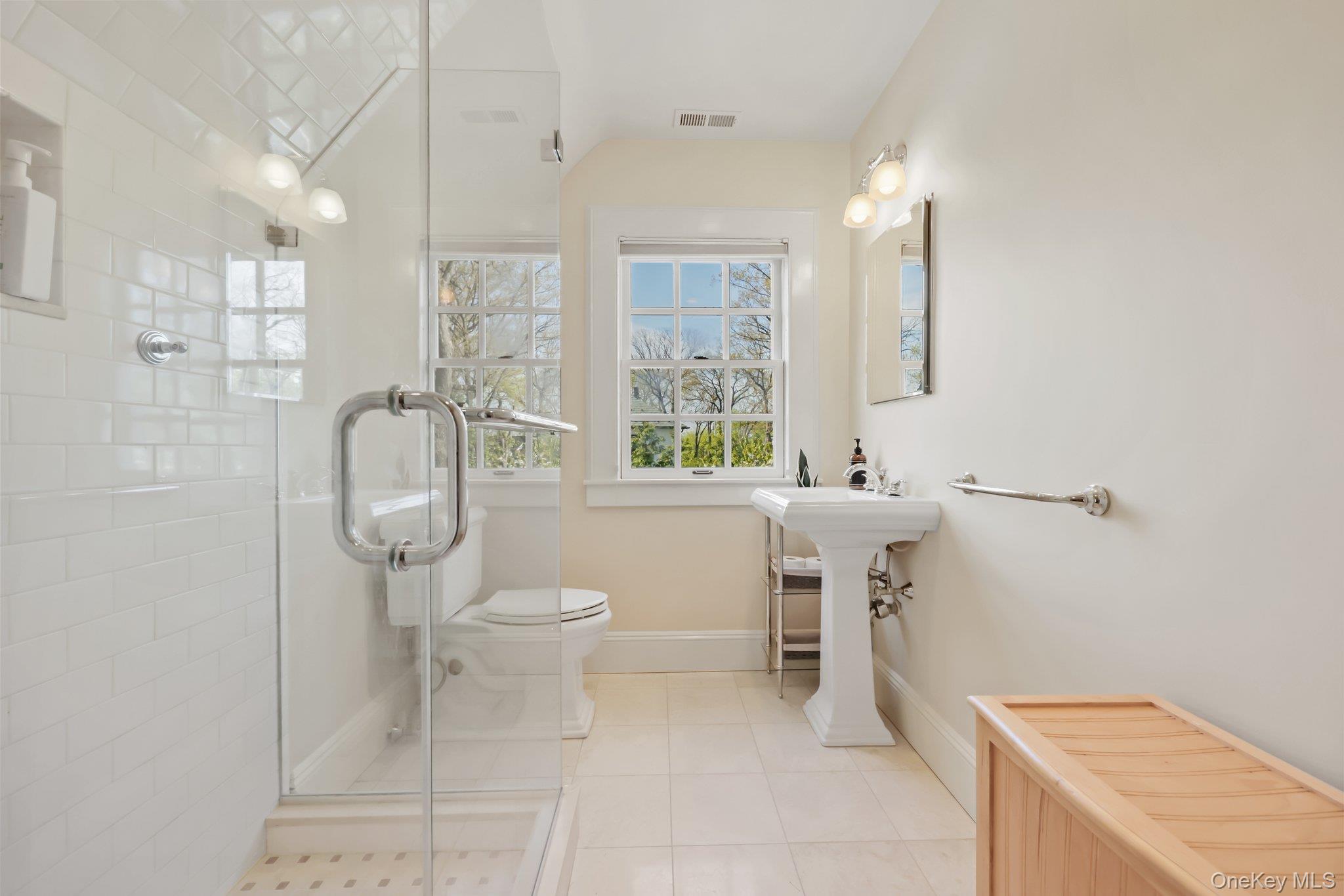 7 Plateau Circle West Bronxville, NY 10708 - Photo 28 of 34 a bathroom with a sink a toilet and shower