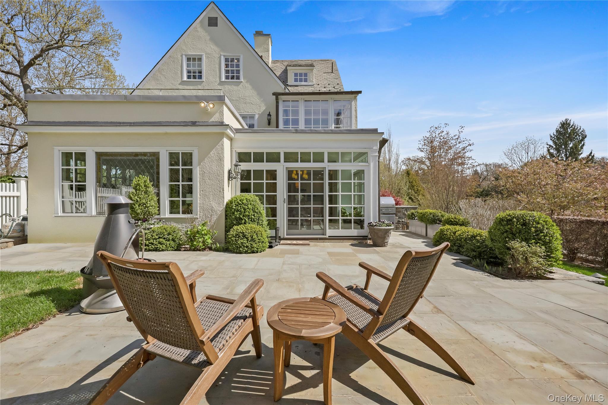 7 Plateau Circle West Bronxville, NY 10708 - Photo 31 of 34 a view of a house with backyard sitting area and garden