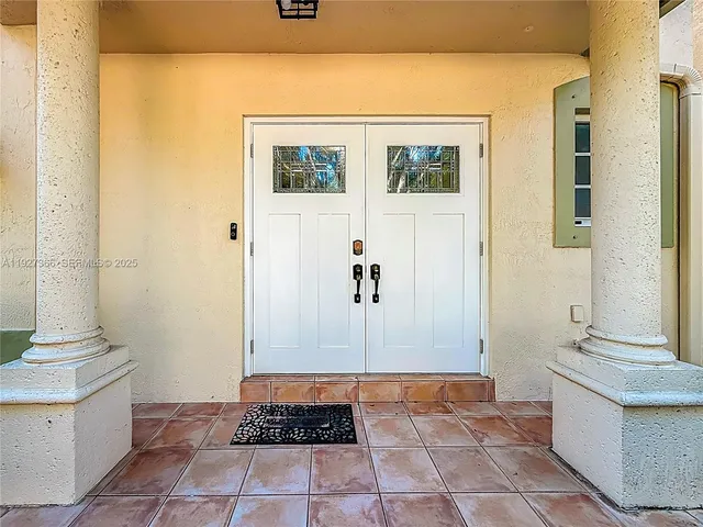 a bathroom with a granite countertop sink a toilet and a mirror