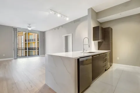 a kitchen with a microwave and a stove