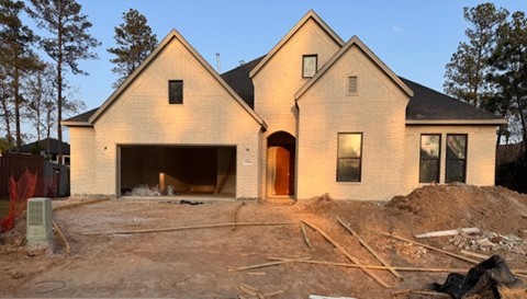 12846 Frst Gdn Court Conroe, TX 77302 - Photo 2 of 5 a view of a house with large windows