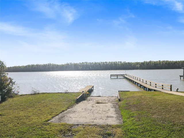 a view of a lake with houses in the background