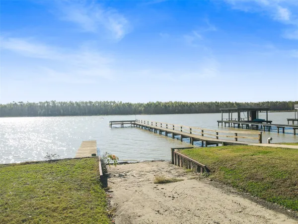 a view of a lake with houses in the back