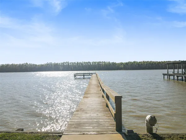 a wooden pier with boats in it