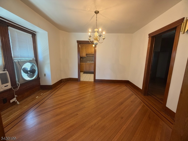 72 Baldwin Place, Unit 2 Bloomfield, NJ 07003 - Photo 15 of 24 a view of empty room with wooden floor