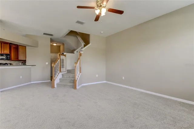 a view of an empty room with a fireplace