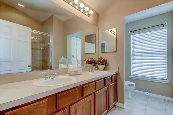 a bathroom with a glass shower door
